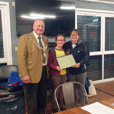 The Chairman and two competition winners.