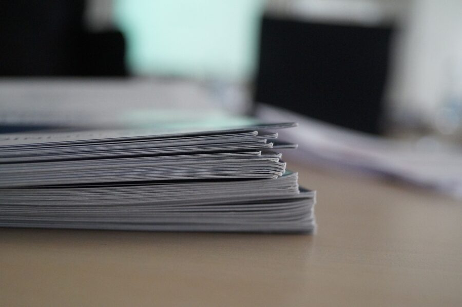 A pile of papers and reports.